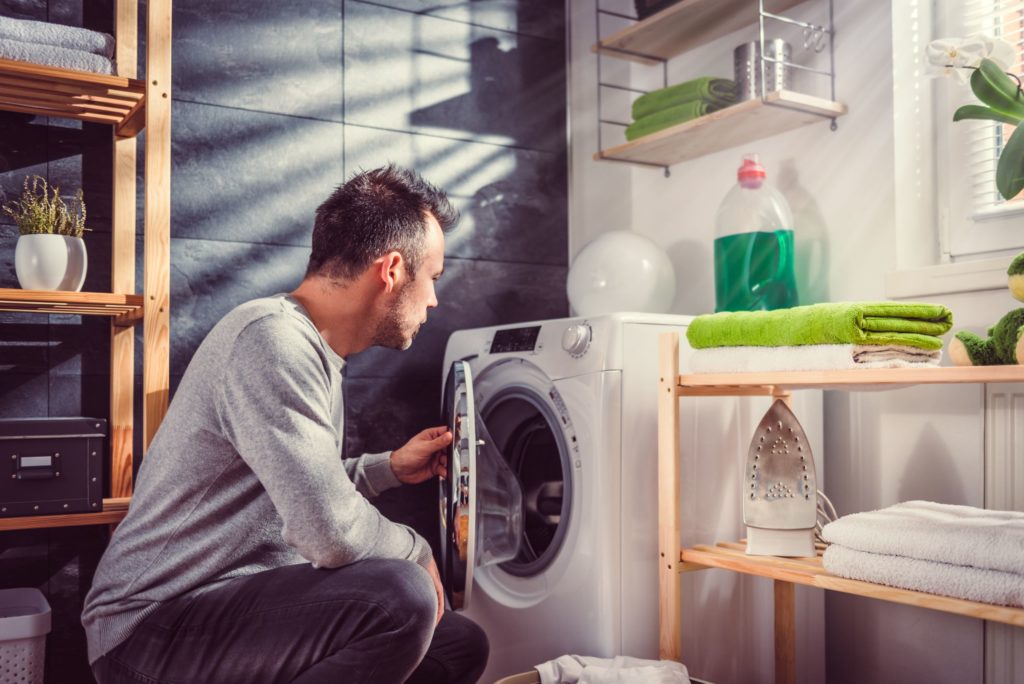 Man opening the dryer
