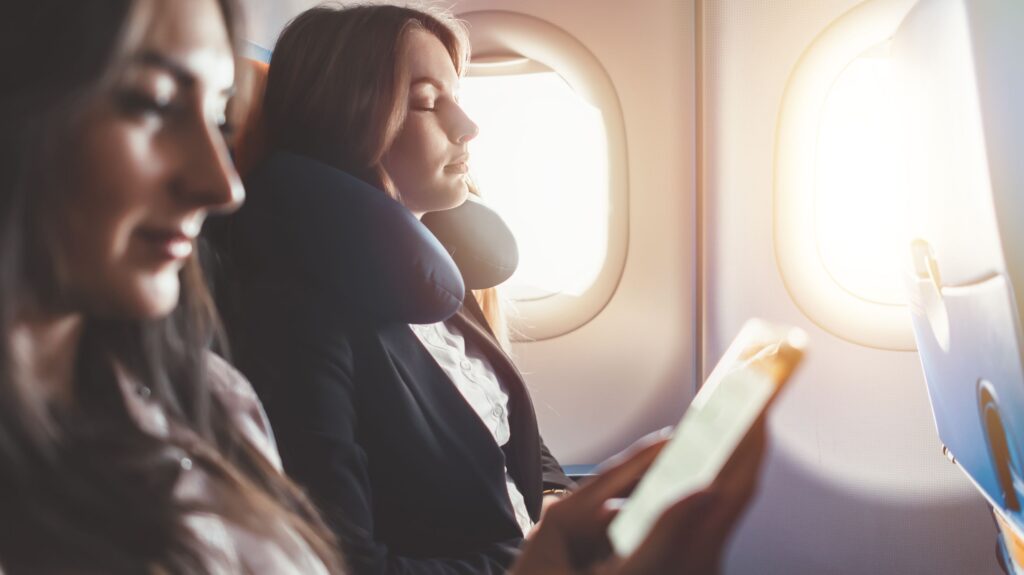 Woman sleeping during a flight.