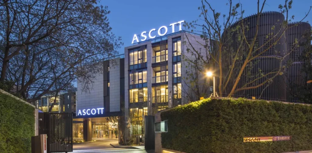 Ascott building at night with lights lighting up the building.