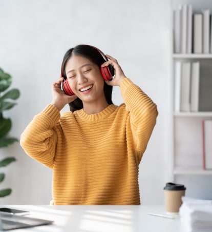 Woman listening to music with headphones