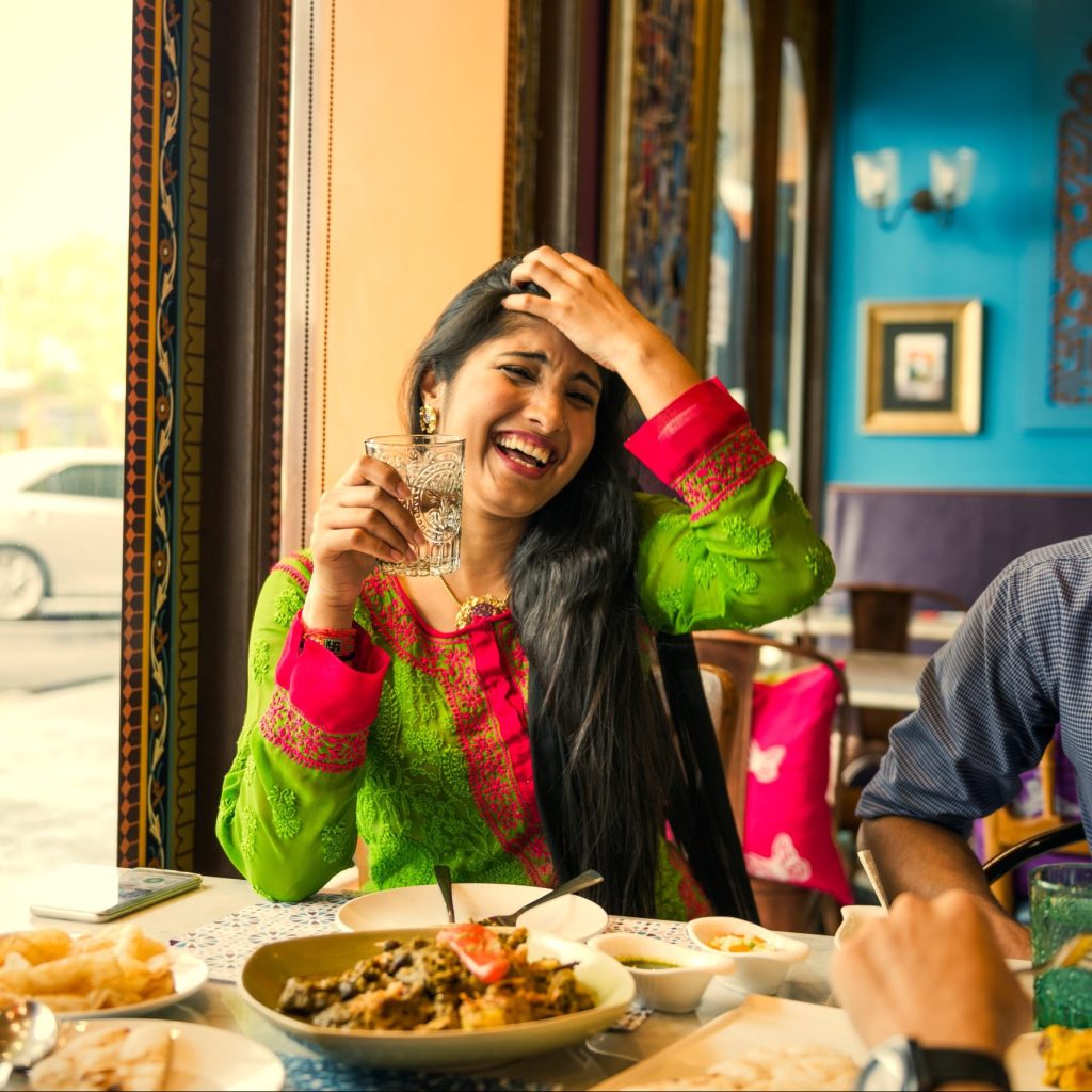 Woman enjoying dinner.