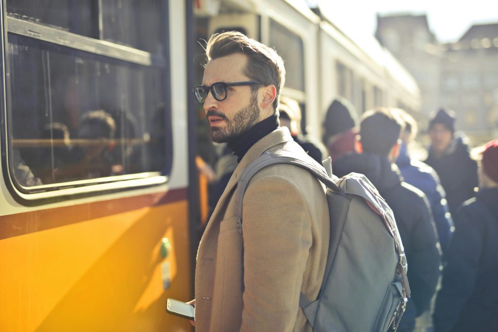 Businessman traveling on public bus.