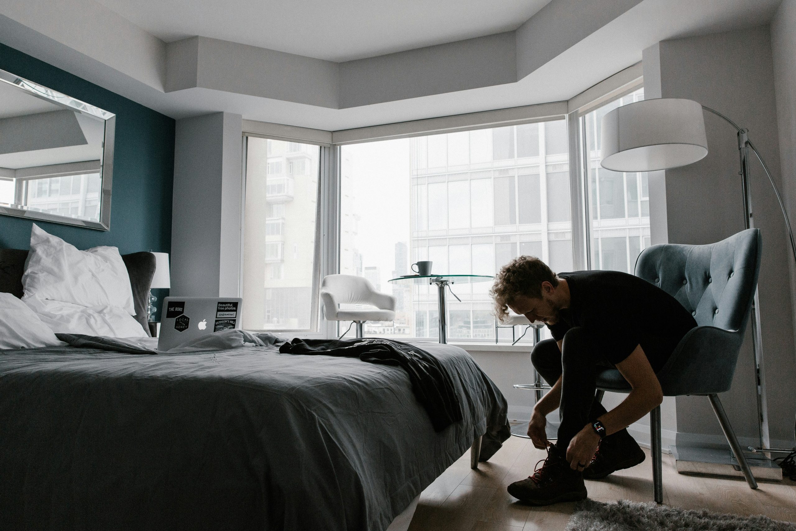 Man getting ready for his day in his apartment.