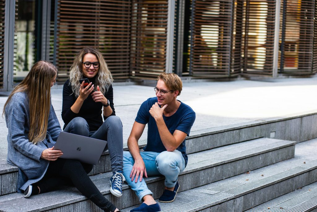 Interns sitting on a stair case